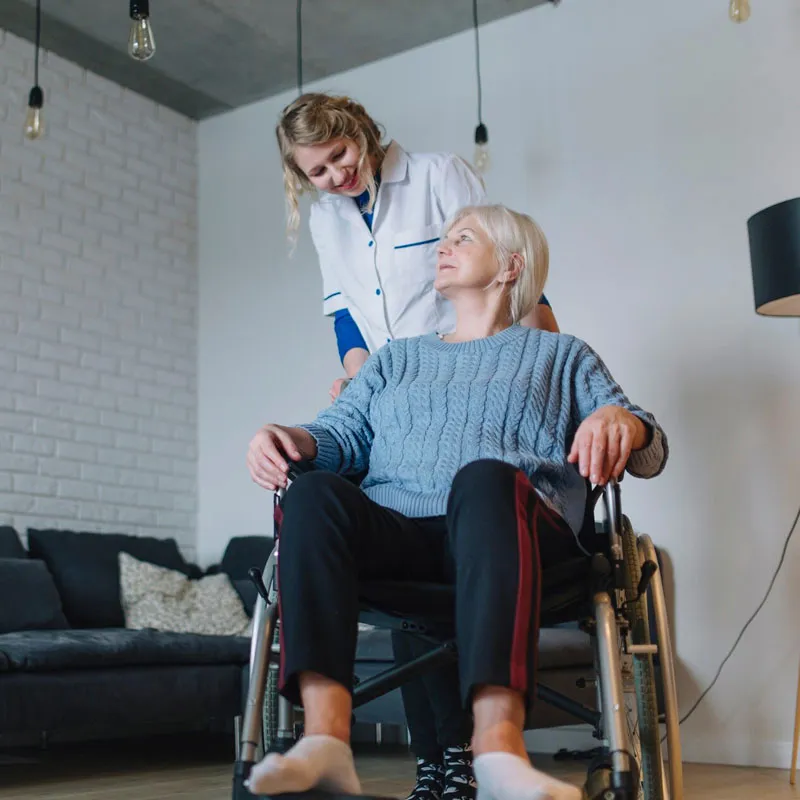 Support worker helping a participant with a daily activity at home
