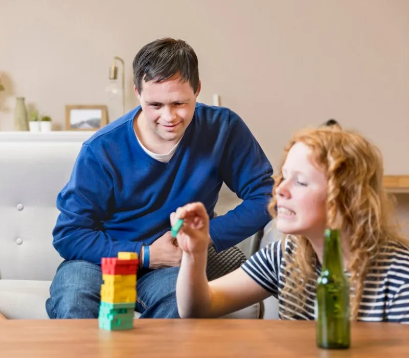 Support worker helping a participant practise using public transport