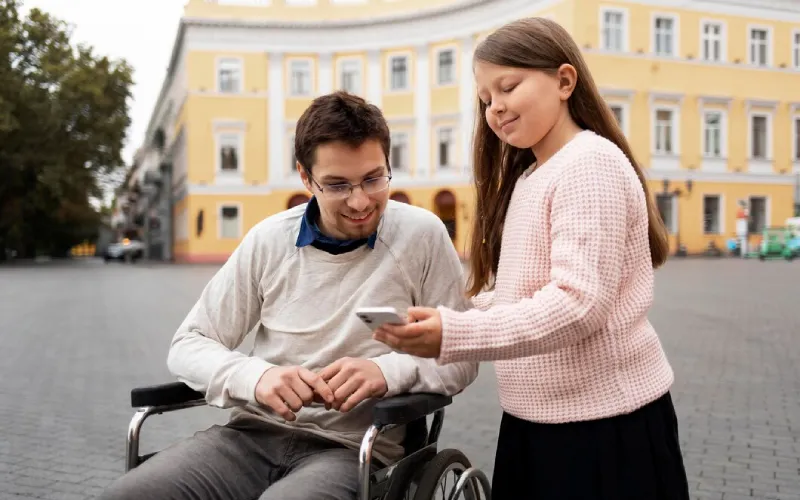 Support worker assisting a participant with a mobility aid while travelling