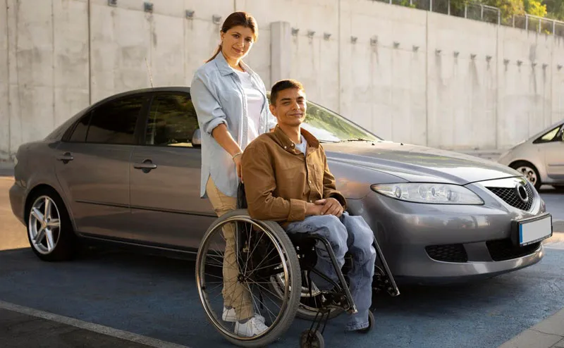 Support worker assisting a participant with a daily task at home